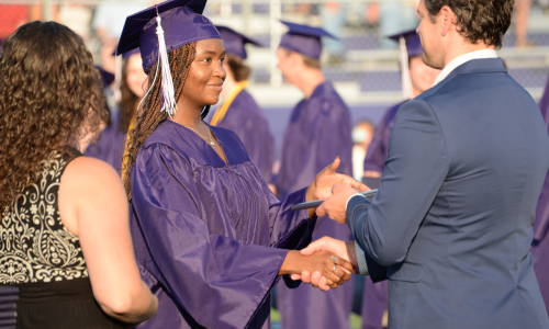 Graduate receives diploma