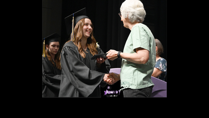 Student receives diploma