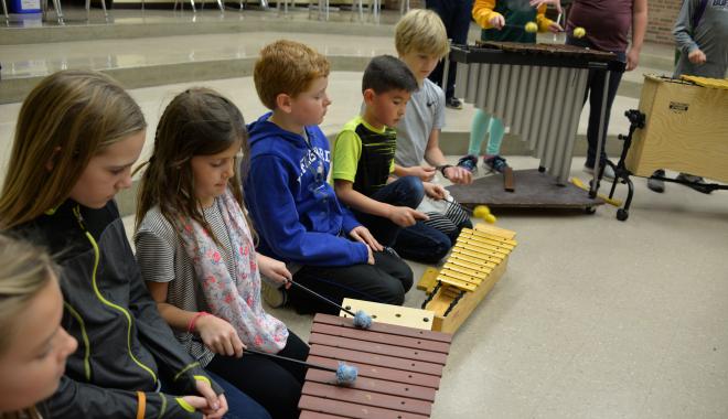 students playing bells