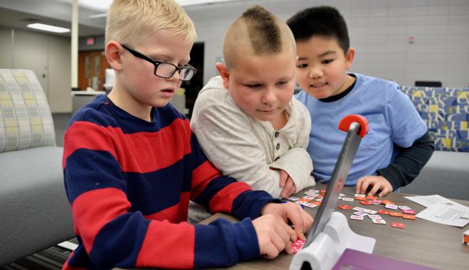 boys playing with technology