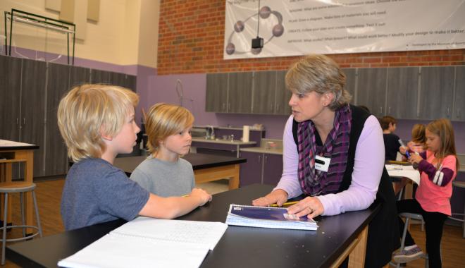 teacher with two boy students