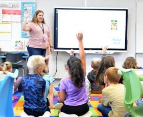 Students raise hands