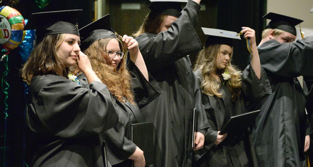 Students move their tassels
